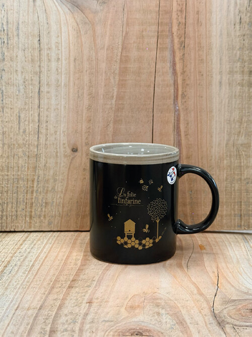 Mug noir à l'effigie de la folie de finfarine